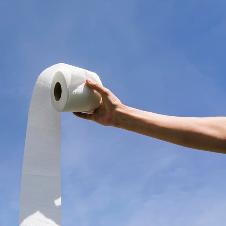 side-view-hand-with-toilet-paper-roll